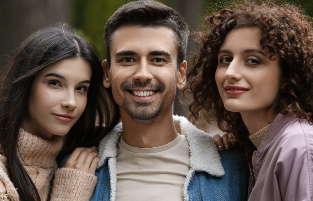 man with two smiling girls