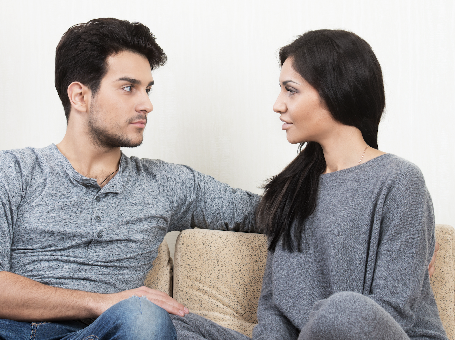 couple communicating on the couch supporting open relationship section