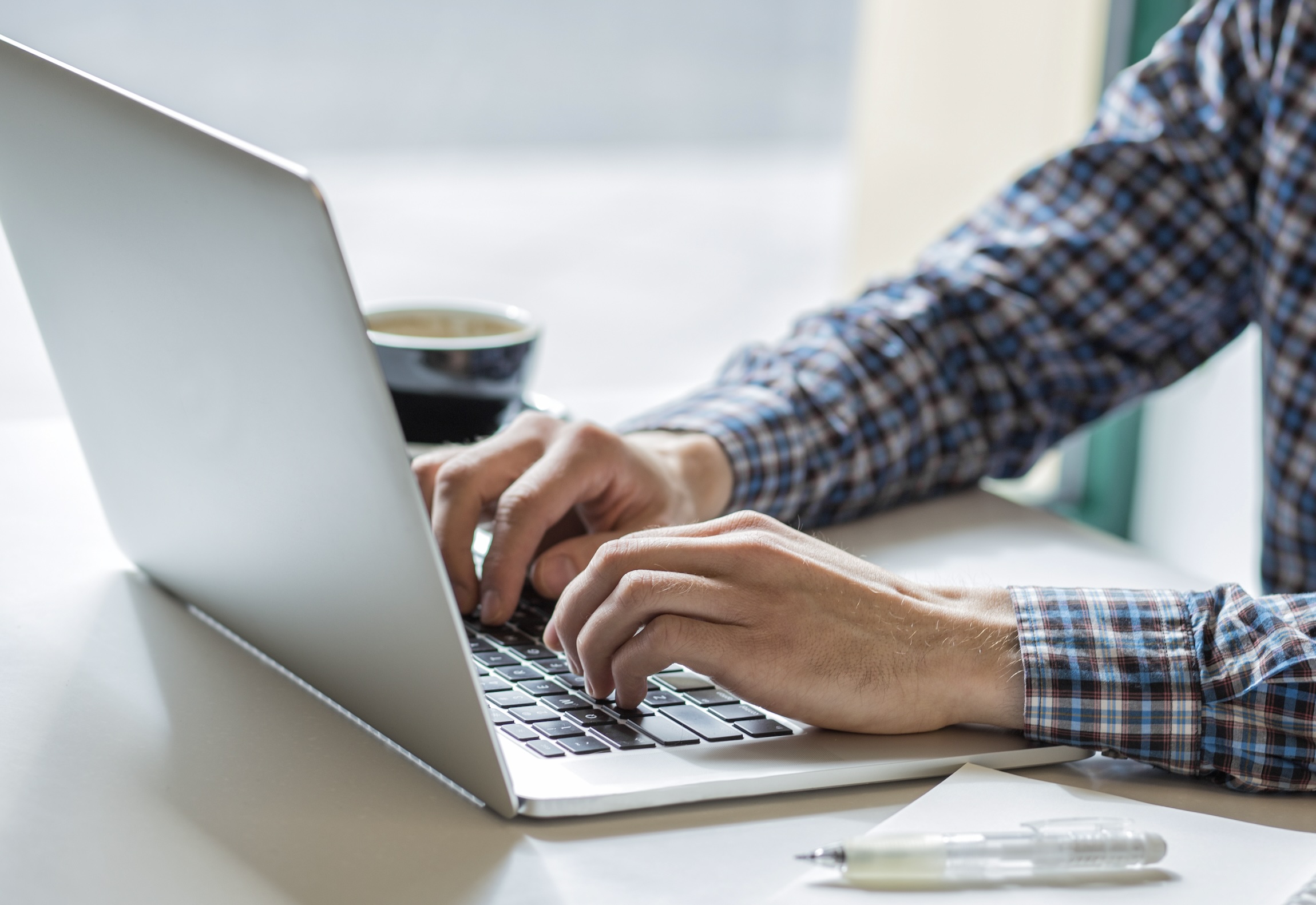 man typing on laptop for ghosting article