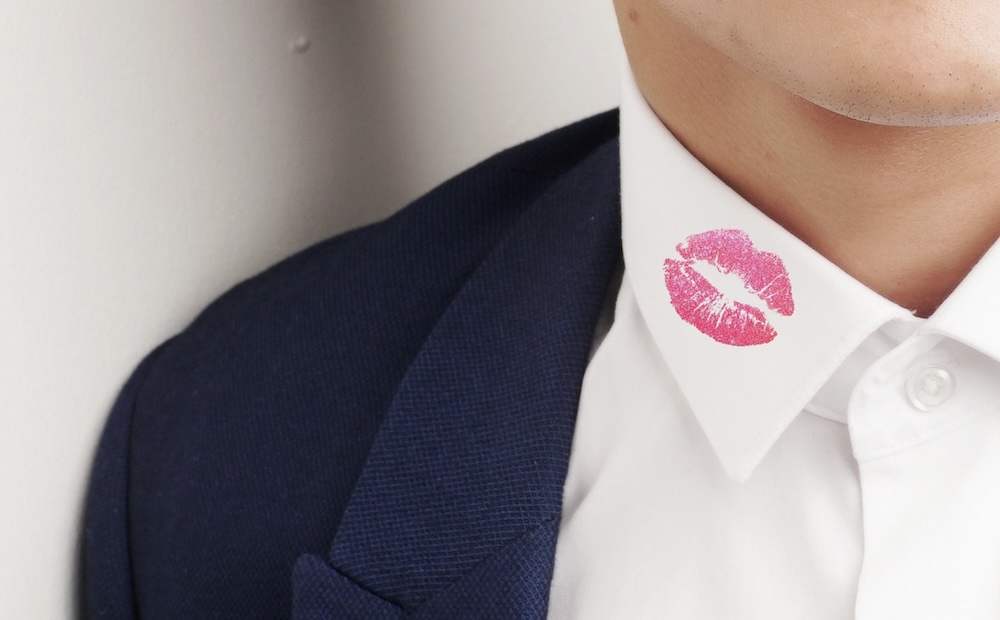 man with lipstick on collar