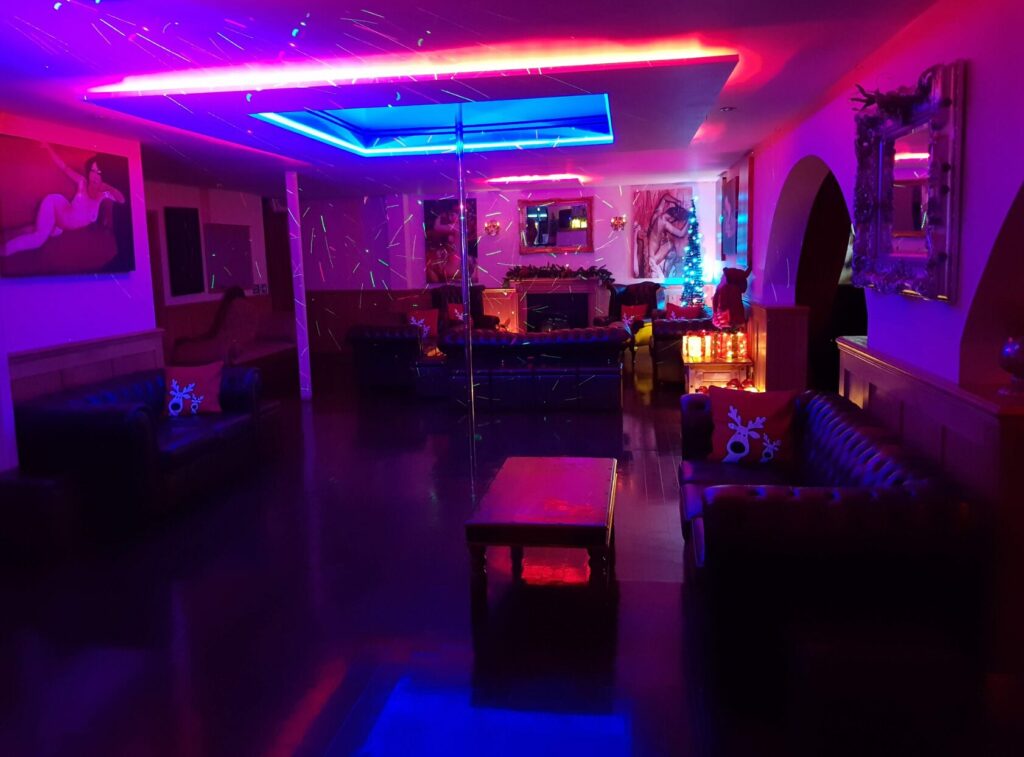 Interior of one part of the swingers club Hellfire, strip pole room
